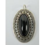 An onyx pendant , stamped 925 and measuring 3.3cm inc bale.