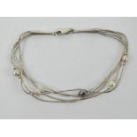 A sterling silver and coloured pearl bracelet having Native American Pictomark upon (unknown