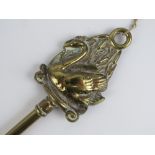 A brass shoe horn having decorative Swan shaped finial, 50.5cm in length.