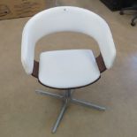 A contemporary white leatherette chair by Allermuir, 1960s style.