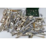 A quantity of assorted silver plated and other cutlery inc wine collar, serving spoons,