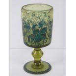 A green glass footed goblet having hunting scene in blue upon featuring lady on horseback,