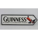 A contemporary cast metal Guinness sign, 38cm in length.