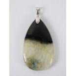 A large hardstone pendant in black and white, bale stamped 925, total length 6cm.