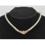 Vintage Christian Dior; a faux pearl necklace measuring approx 40cm in length, marked Chr.