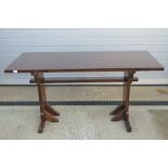 A 20th century stained pine kitchen trestle type table, 5ft x 2ft, 75cm high.