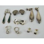 Six pairs of silver earrings including; green Art Deco style enamelled drops, Viking ship clip-on,