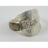 A silver ring formed from a salt spoon having hardstone cabachon upon, size W-X.