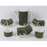 A Susie Cooper coffee service in 'Forest' c2094 pattern including six coffee cans and saucers,