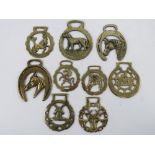 A quantity of assorted contemporary horse brasses of various themes. Nine items.