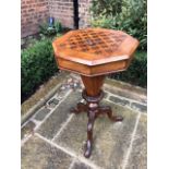 A Victorian chequer-top sewing table in walnut and mahogany.