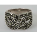 A silver and marcasite ring having four rows of 'woven' marcaties, graduated band measuring 1.