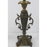 A brass table lamp in the form of an urn on plinth, standing 34cm high.