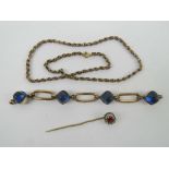 Three antique pieces of jewellery including a German rolled gold bracelet section set with blue