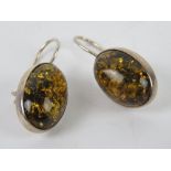 A pair of Baltic Amber earrings, each cabachon approx 1.8 x 1.