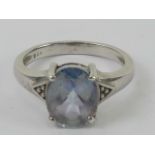 A silver and Topaz ring (light mystic colouring mostly purple/blue with a green flash),