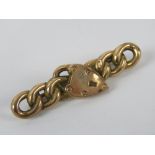 A 9ct gold bar brooch in the form of chain and heart padlock, stamped 9ct, 4.5cm wide, 1.8g.