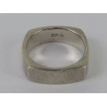A HM silver ring of unusual square form, plain heavy band, hallmarked for Sheffield, size O-P, 8.1g.