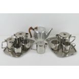 A Picquot water tea pot, together with two stainless steel tea services with trays.