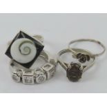 Four silver rings size K-L, including smoky quartz, white stone stamped 925,