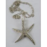 A large silver starfish pendant encrusted with white stones, stamped 925, approx 2.5cm in length, 3.