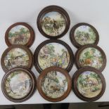 A collection of 'Life on the Farm' decorative plates in frames,