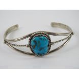A Richard Begay Native American (Navajo) sterling silver cuff style bangle set with turquoise,