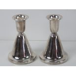 A pair of silver Chrisophersen short candlesticks,