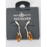 A pair of silver and Baltic amber stud earrings, 3.4cm in length, unused on original packaging.