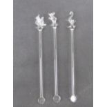 Three glass cocktail twizzle sticks each having animal finial inc dove, swan and mouse.