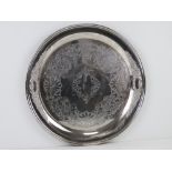 A large silver plated salver tray having floral repoussé border and further engraved floral