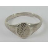 A 925 silver signet ring having half floral engraving, size O.