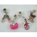 A set of four silver and enamel Pandora style charms, each stamped 925, in the form of a handbag,