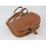 A vintage leather shooting style handbag