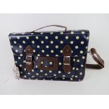 A blue polka dot satchel type handbag 'a