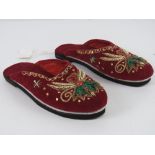 A pair of red velvet embroidered slipper