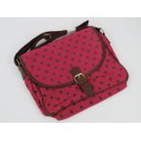 A red polka dot fabric handbag 'as new'