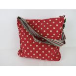 A fabric tote bag red polka dot pattern