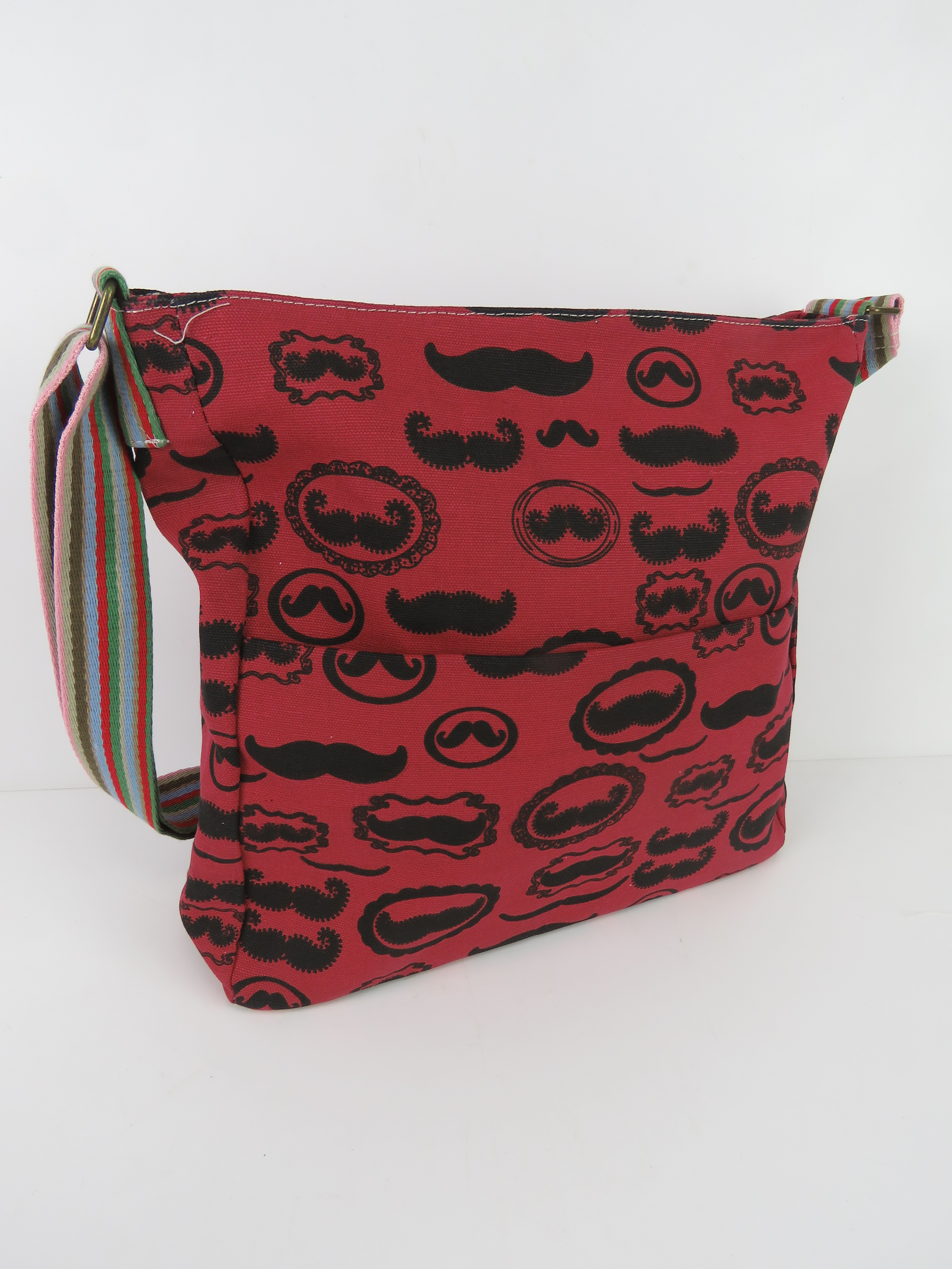 A fabric tote bag having mustache patter