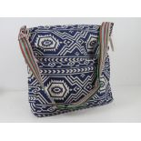 A fabric navy blue Aztec pattern tote ba