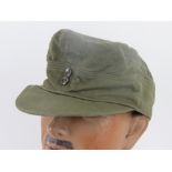 A green cloth 'tropical' cap having removed label and removed cloth badge from front.