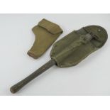 A WWII Pattern 38 holster together with a US trench tool.