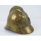 A WWII French Firemans helmet with chin strap.