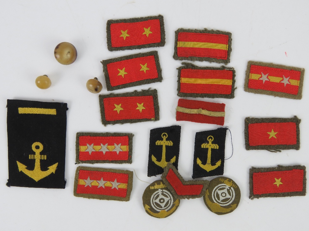 A quantity of assorted WWII Japanese cloth insignia rank badges and buttons including senior,