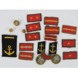 A quantity of assorted WWII Japanese cloth insignia rank badges and buttons including senior,