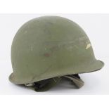 A US M1 helmet with Vietnam liner.