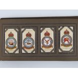 A cigarette card album containing a quantity of cards for regiments and planes,