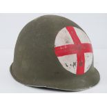 A WWII US medics helmet having liner and chin strap.