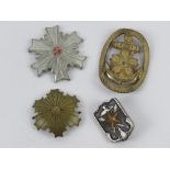 A quantity of WWII Japanese badges. Four items.