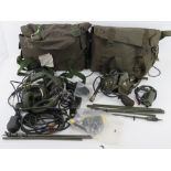 Two British Military Radio headsets having cables and switches, in British transit bags.